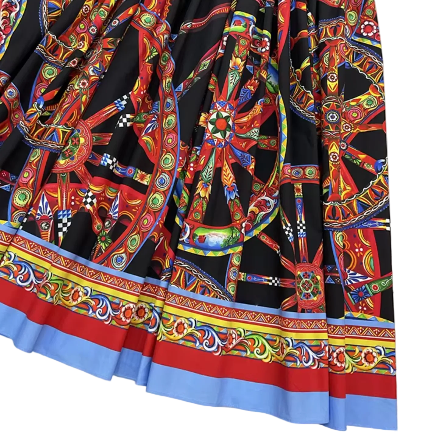 A close-up of a black skirt featuring a vibrant, multicolored traditional geometric and floral pattern, finished with a decorative border in red, light blue, and multicolor.